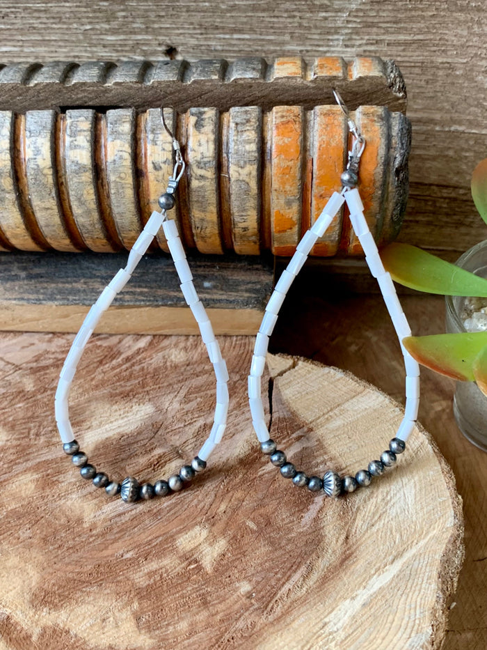 White shell bead drop earrings with long dangles and sterling silver hooks