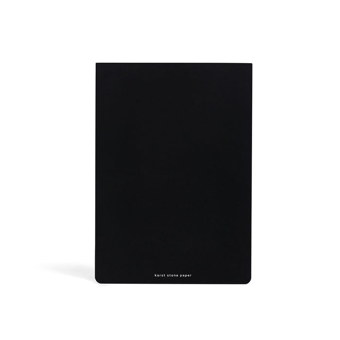 Karst A5 Stone Paper Daily Action Pad with minimalist black cover, eco-friendly stone paper planner for daily scheduling, task lists, productivity planning, and goal tracking.