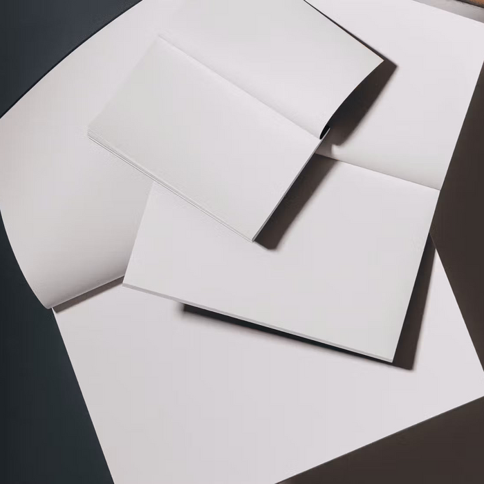 White envelopes on a black surface