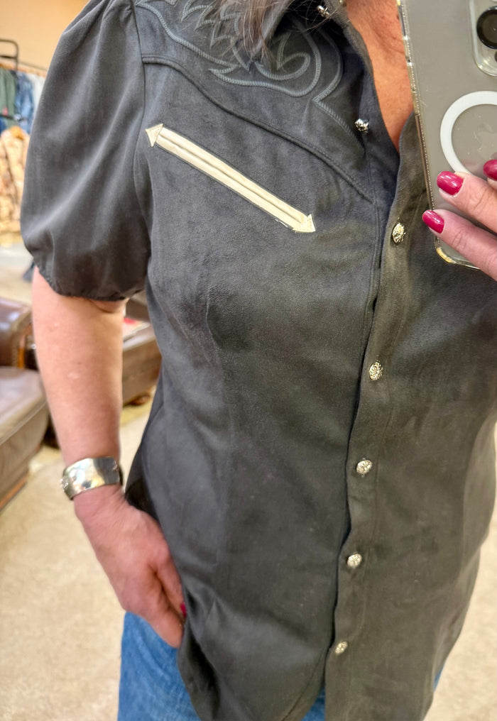 Black yoke button-front shirt, close-up of placket and short puff sleeves