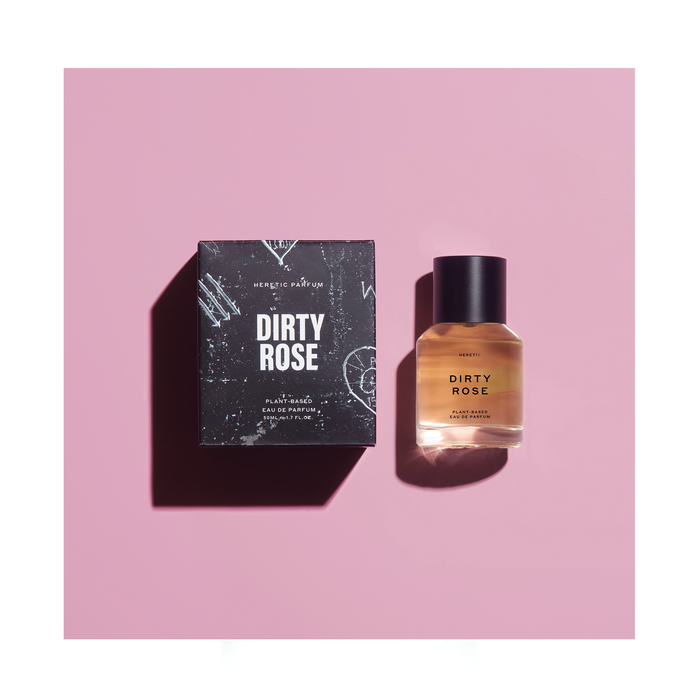 Photo of 'Dirty Rose' Perfume by Heretic next to a black box on a pink background