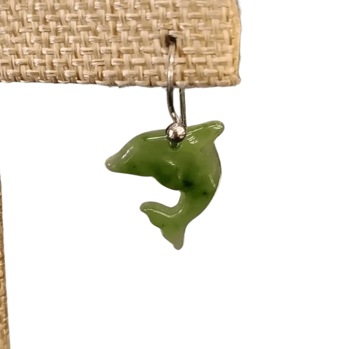 This is a close up of one of the Jade dolphins earrings