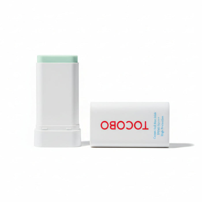 Two Tocobo skincare products on a dark surface
