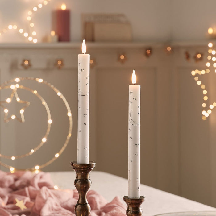 CA24005-Set-of-2-TruGlow-Taper-Candles-with-Moon-_-Star-Design.jpg