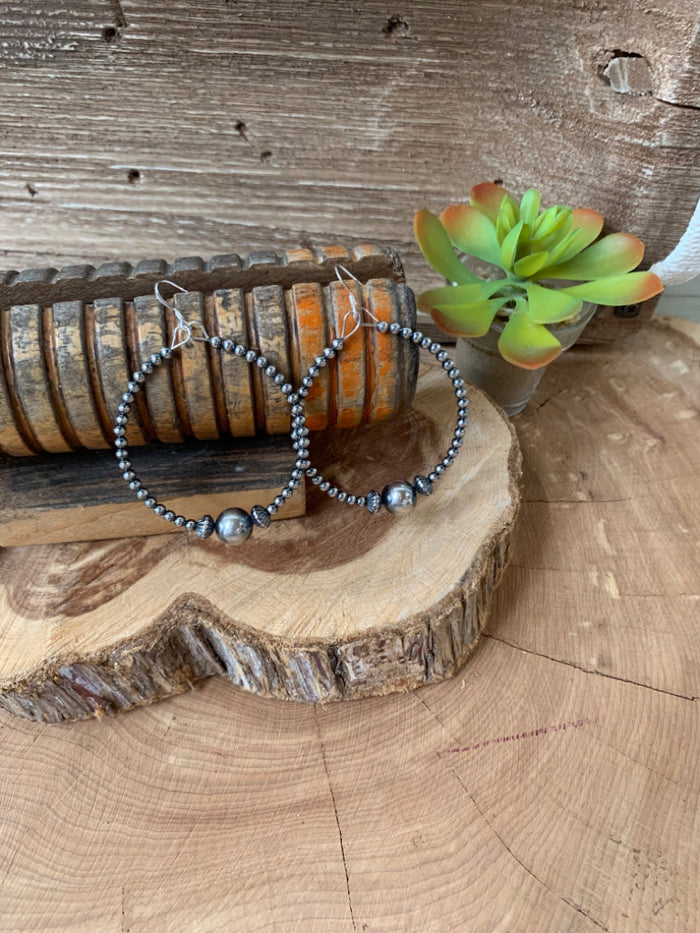 Sterling silver hoop earrings with small bead and round ball accents