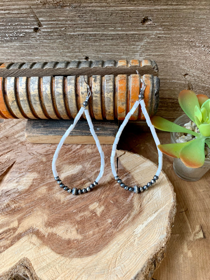 White shell bead drop earrings with sterling silver hooks and dark bead accents
