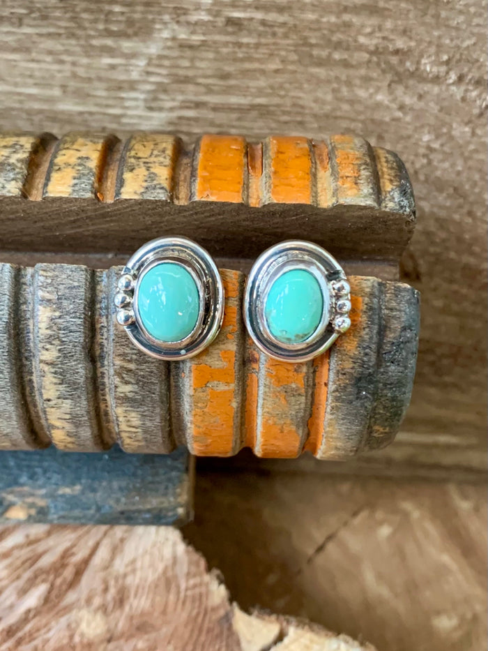Sterling silver turquoise stud earrings with round turquoise stones and silver rope trim
