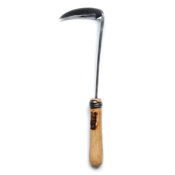 Hand-forged small weeding hoe with a curved dark steel blade and light wooden handle, displayed on a clean white background in a minimalist artisan gardening tool presentation.