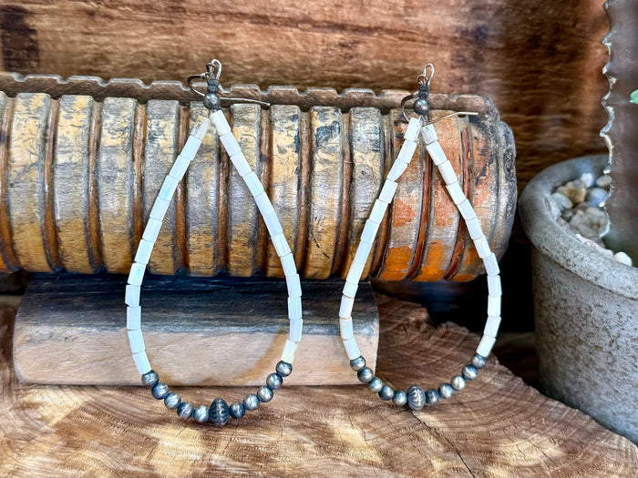 White shell bead hoop earrings with sterling silver hooks and clustered dark beads