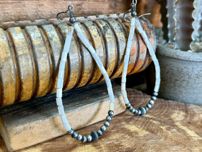 White shell bead dangle earrings with sterling silver hooks and dark bead hoop base