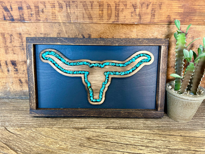 Turquoise longhorn art with turquoise string in dark blue wood frame