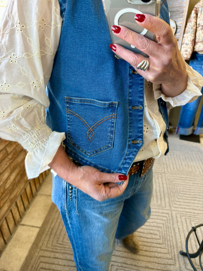 Denim vest front pocket with contrast stitched panel and metal buttons