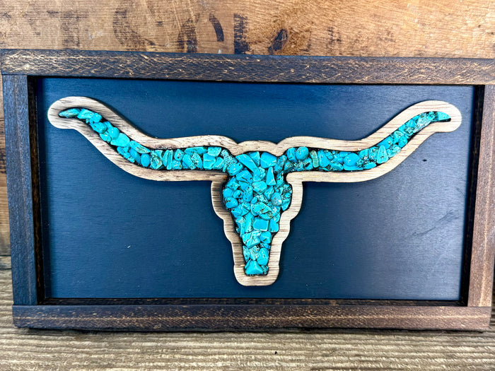 Wood framed longhorn wall art with textured turquoise head and horns on blue.