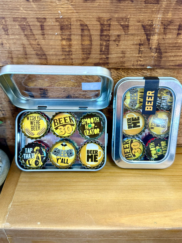 Handmade beer magnets set in metal tin, six colorful caps including “Beer Me”