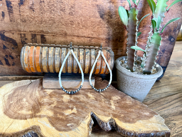 Pair of white shell bead drop earrings with sterling hooks and dark bead accents