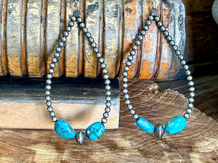 Silver bead hoop earrings with turquoise oval stones and pearl-like bead accents