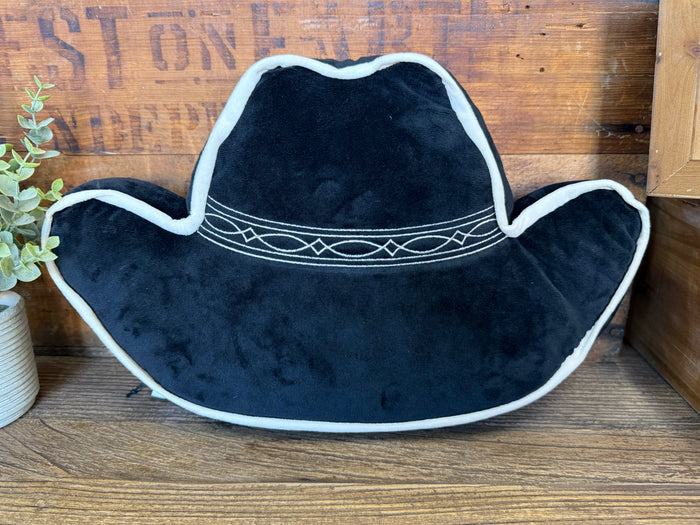 Black cowboy hat pillow with white edge trim and stitched band detail