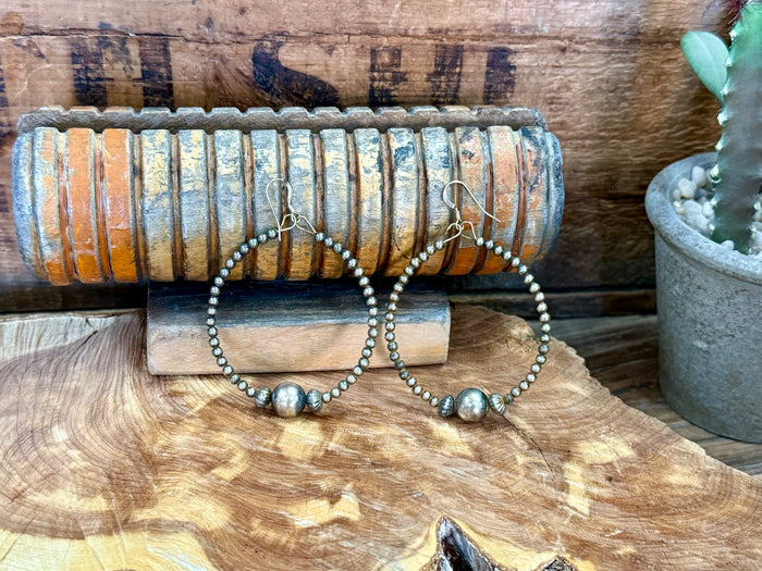 Sterling silver hoop earrings with beaded strands and round bead drops