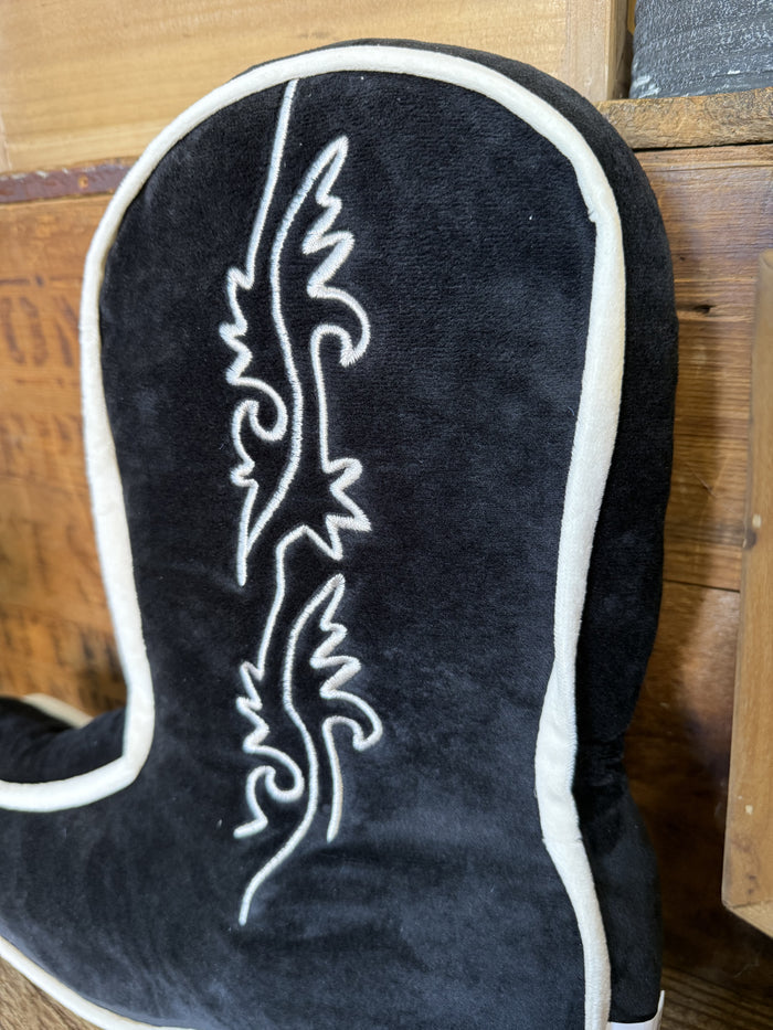 Black cowboy boot-shaped pillow front detail with white piping and scroll embroidery
