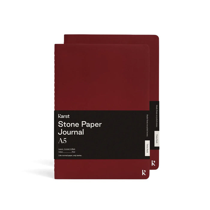 Karst A5 Stone Paper Journal twin pack in pinot red with soft covers and black branded belly band, displayed on a light gray background.
