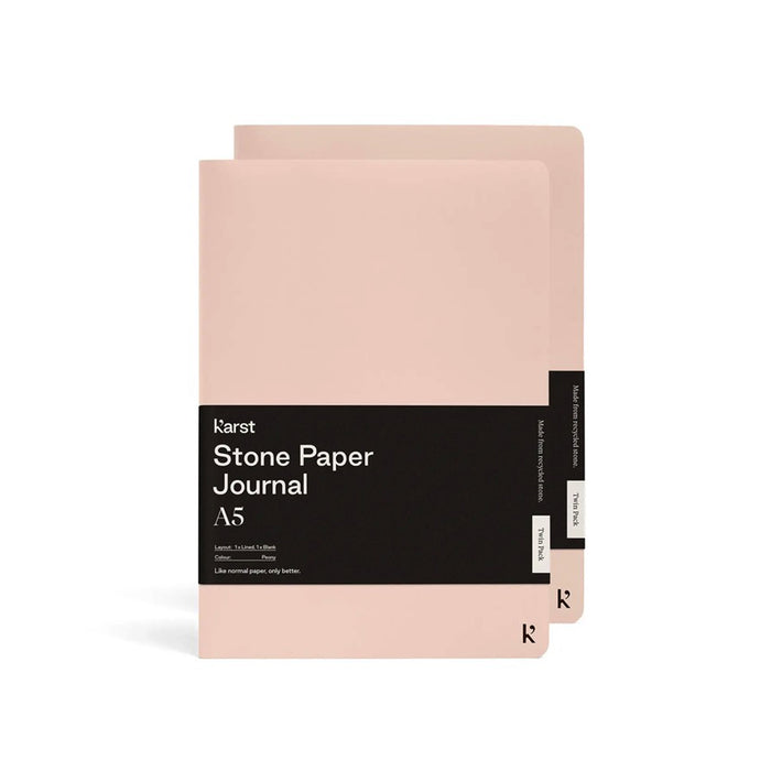 Karst A5 Stone Paper Journal twin pack in peony pink with soft covers and black branded belly band, displayed on a light gray background.