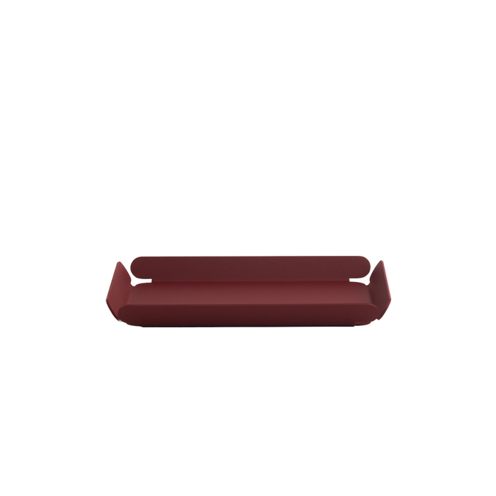 Minimalist burgundy desk tray with a low-profile rectangular shape and curved ends, designed for organizing small office items, shown on a white background.