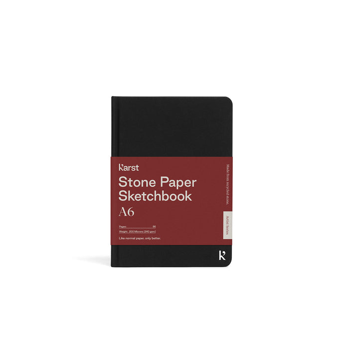 Karst Stone Paper Sketchbook A6 with black cover and red band packaging, featuring smooth waterproof stone paper designed for drawing, sketching, and creative artwork.