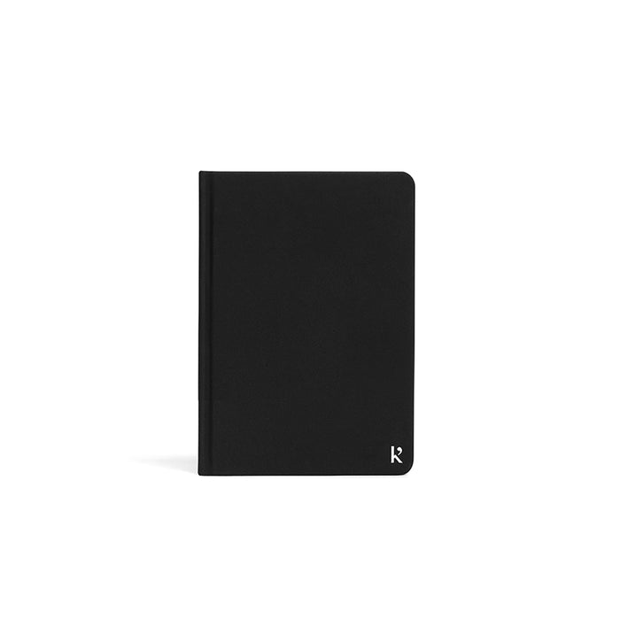 Karst A6 Stone Paper Sketchbook with minimalist black hardcover and rounded corners, designed for smooth drawing, sketching, and creative artwork on waterproof stone paper.