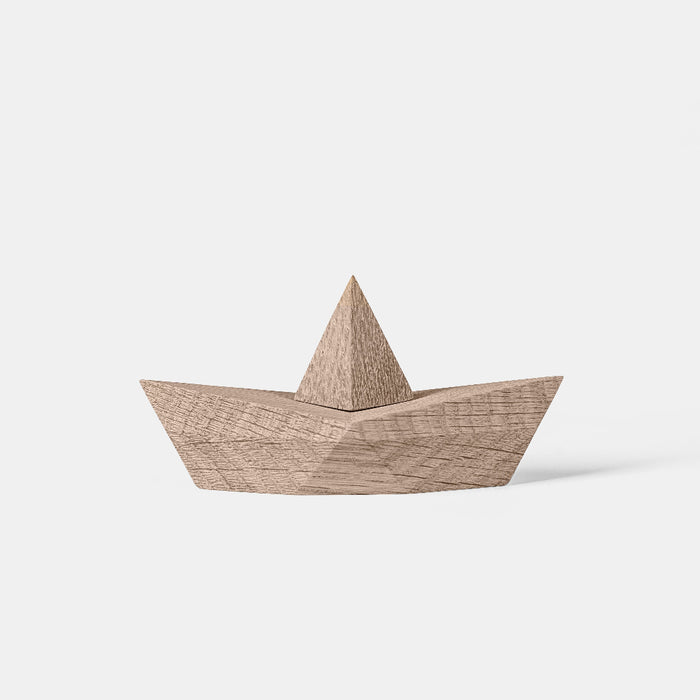 Wooden boat toy on a white background
