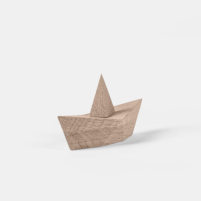 Wooden toy boat on a white background