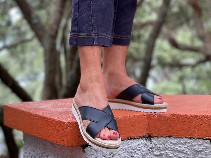 Aerobics are quality European women's sandals and slides. Soft leather with crossover detail in navy. Espadrille detail around the sole unit.