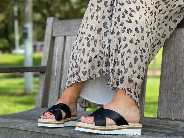 Aerobics are quality European women's sandals and slides. Soft leather with crossover detail in black. Espadrille detail around the sole unit.