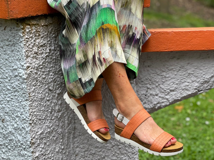 Comfortable European sport inspired sandals made with quality leather. Cork footbed on wedge sole unit. Fabulous women's shoes/sandals in tangerine.