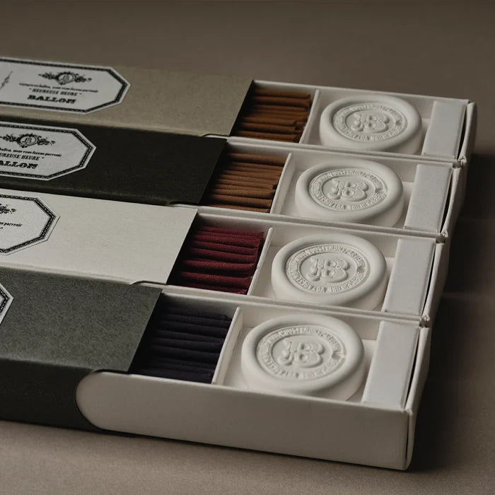 Matchbox with matches and decorative elements on a brown background