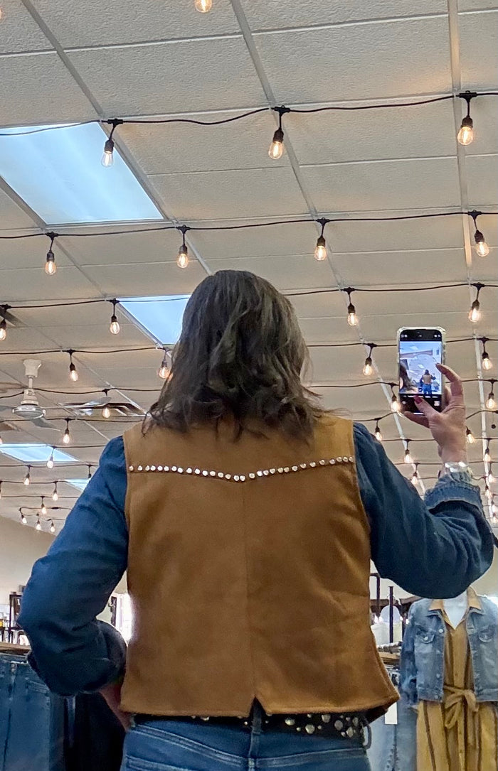 Camel-brown snap-front vest with studded collar trim, shown from back