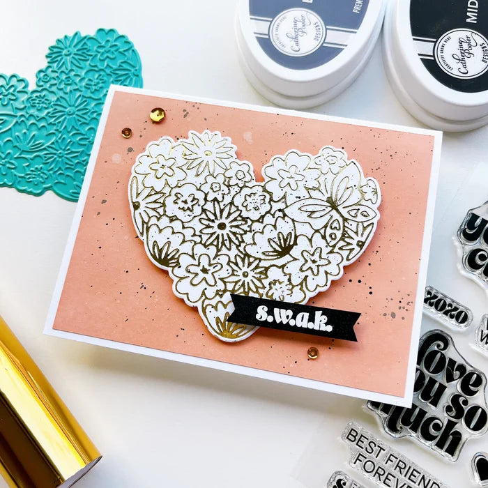 Catherine Pooler - Stamp & Die Set - Hearts Aflutter. Set someone's heart aflutter with this beautiful stamp set and coordinating dies! The Hearts Aflutter Stamps features a large, line-art heart made of flowers and a butterfly. Available at Embellish Away located in Bowmanville Ontario Canada Example by brand ambassador.