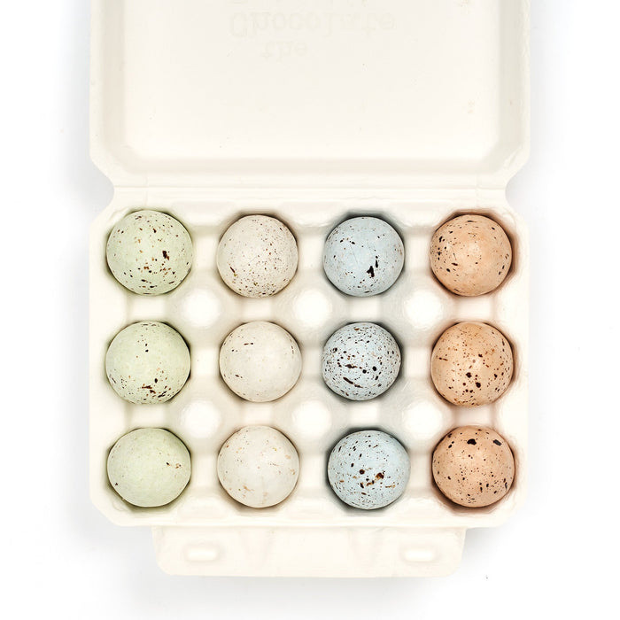Set of colorful bath bombs in a white box on a white background