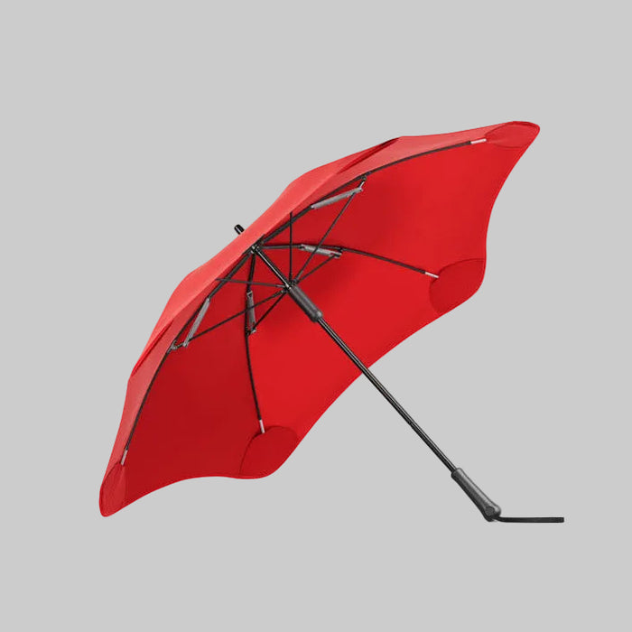 Red umbrella with black frame on a white background
