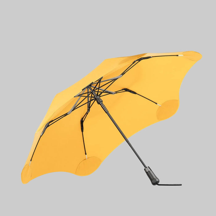 Yellow umbrella with black accents on a white background