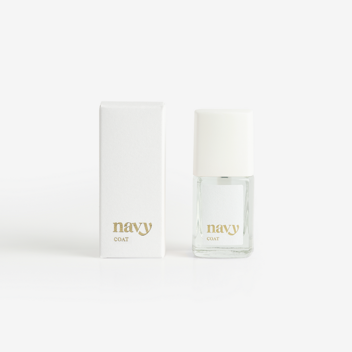 A bottle of Navy Coat nail treatment positioned next to its packaging box, both featuring the brand name 'navy'.