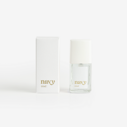 A bottle of Navy Coat nail treatment positioned next to its packaging box, both featuring the brand name 'navy'.