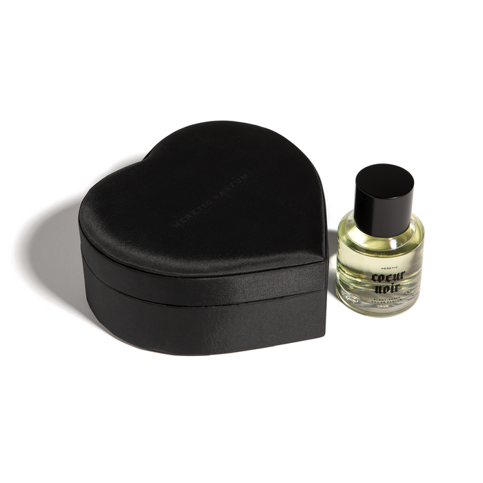 'Coeur Noir' Perfume by Heretic sitting upright next to it's black, satin heart shaped box