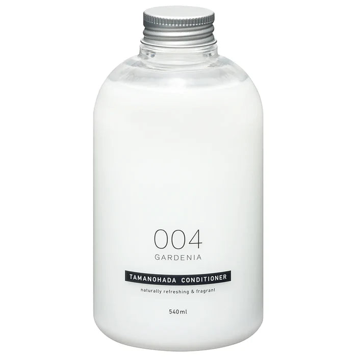 White bottle of Tamanohada Gardenia conditioner with a silver cap on a white background