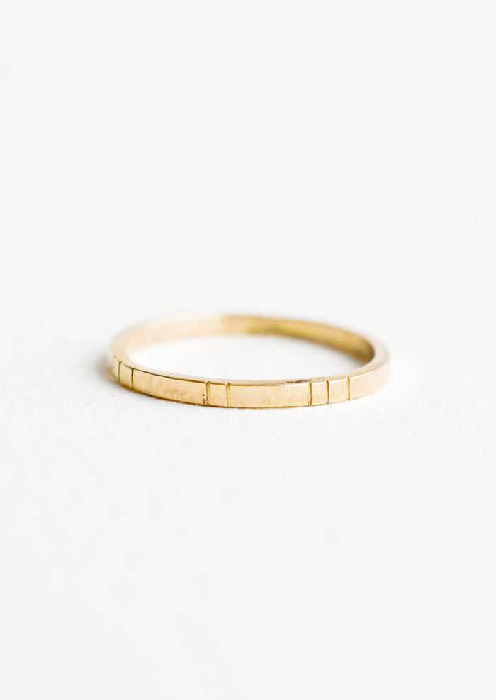 Yellow gold ring, medium weight band with etched decorative lines.
