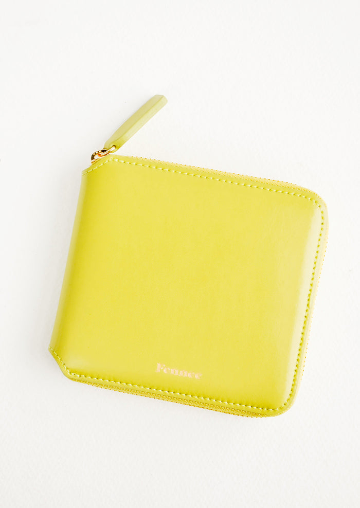 Chartreuse leather wallet that zips on three sides, with matching tab pull.
