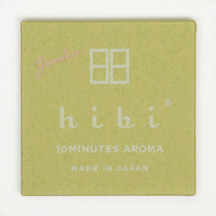 The top of a green hibi 10 Minutes Aroma gift box on a white background, featuring subtle branding and the word “Garden” printed in script in the corner.