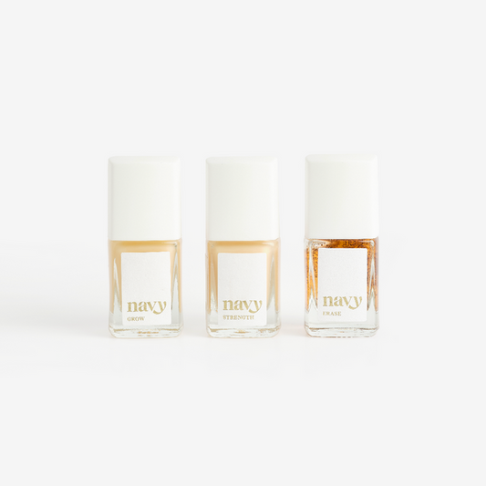 Three bottles of Navy brand nail treatment product arranged side by side against a white background.