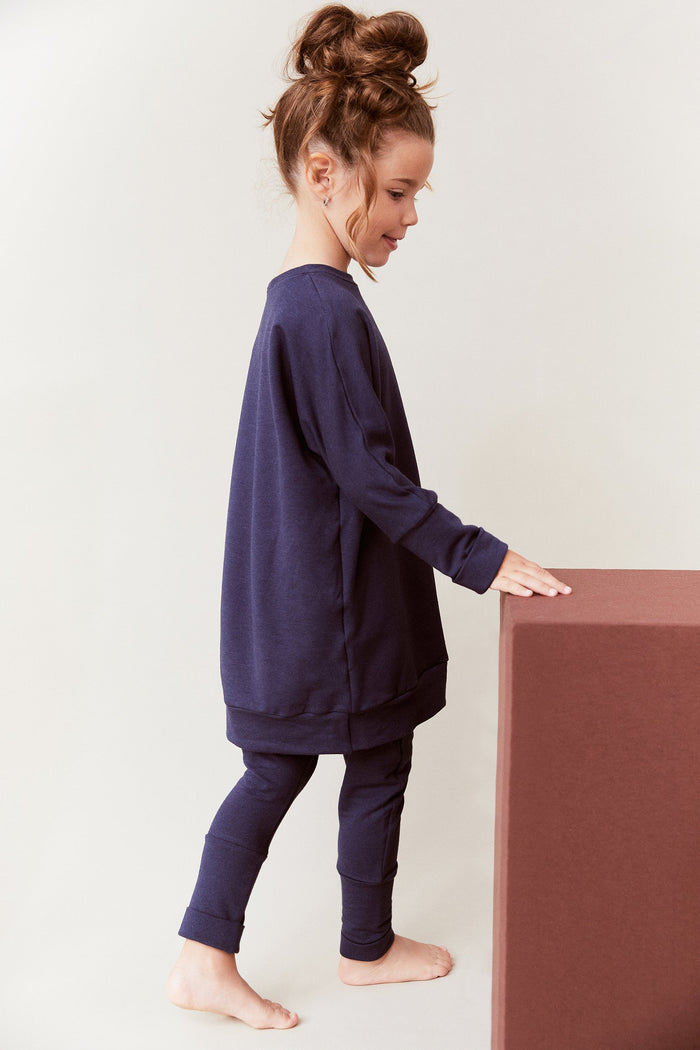 Navy grow-with-me pants for toddlers and kids, made from soft, eco-friendly fabric. Adjustable waistband and cuffs for extended wear. Ethically made in Canada.