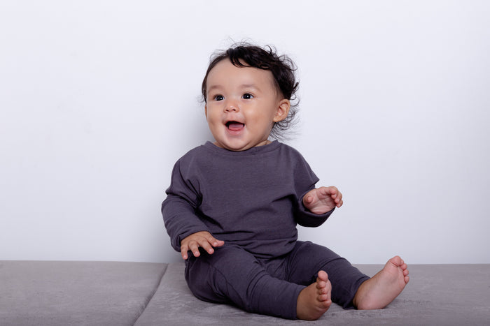 Dark Grey grow-with-me shirt for toddlers and kids, designed to be worn as a dress, tunic, or long shirt. Seamless shoulders and soft, eco-friendly fabric. Ethically made in Canada.
