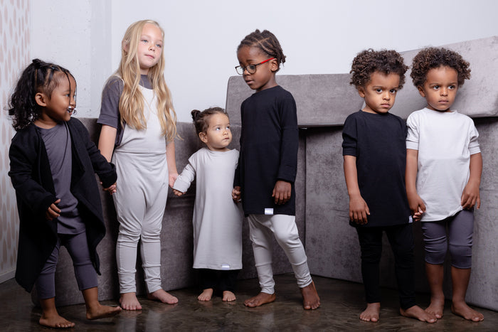 Black grow-with-me t-shirt for kids, made from soft Lyocell. Ethically made in Canada for a sustainable and comfy fit.